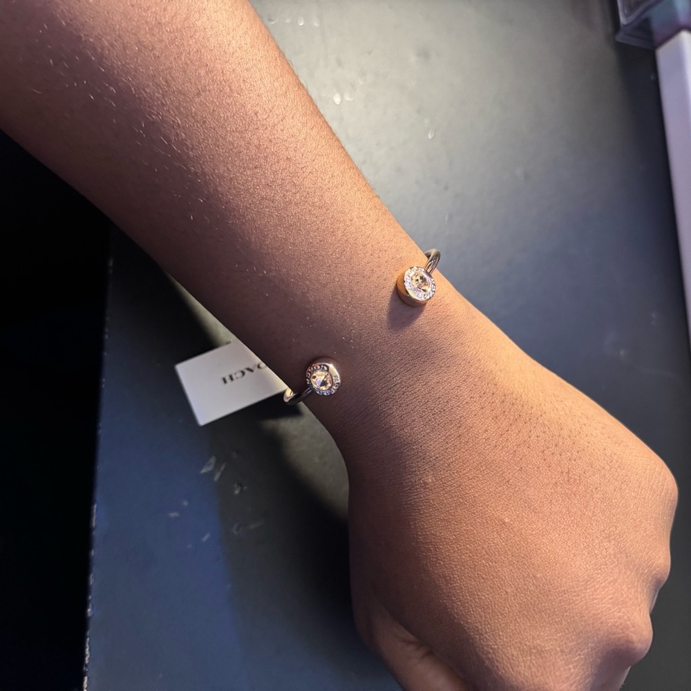 Coach Gold-Tone Open Cuff Bracelet with Clear Crystal Ends